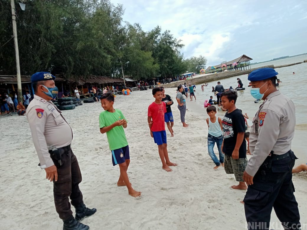 Satpol Air Polres Sergai Cek Penerapan Prokes AKB  di Obyek Wisata Pantai